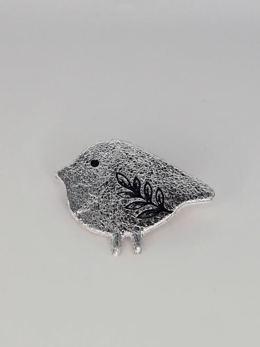 Silvered bird brooch