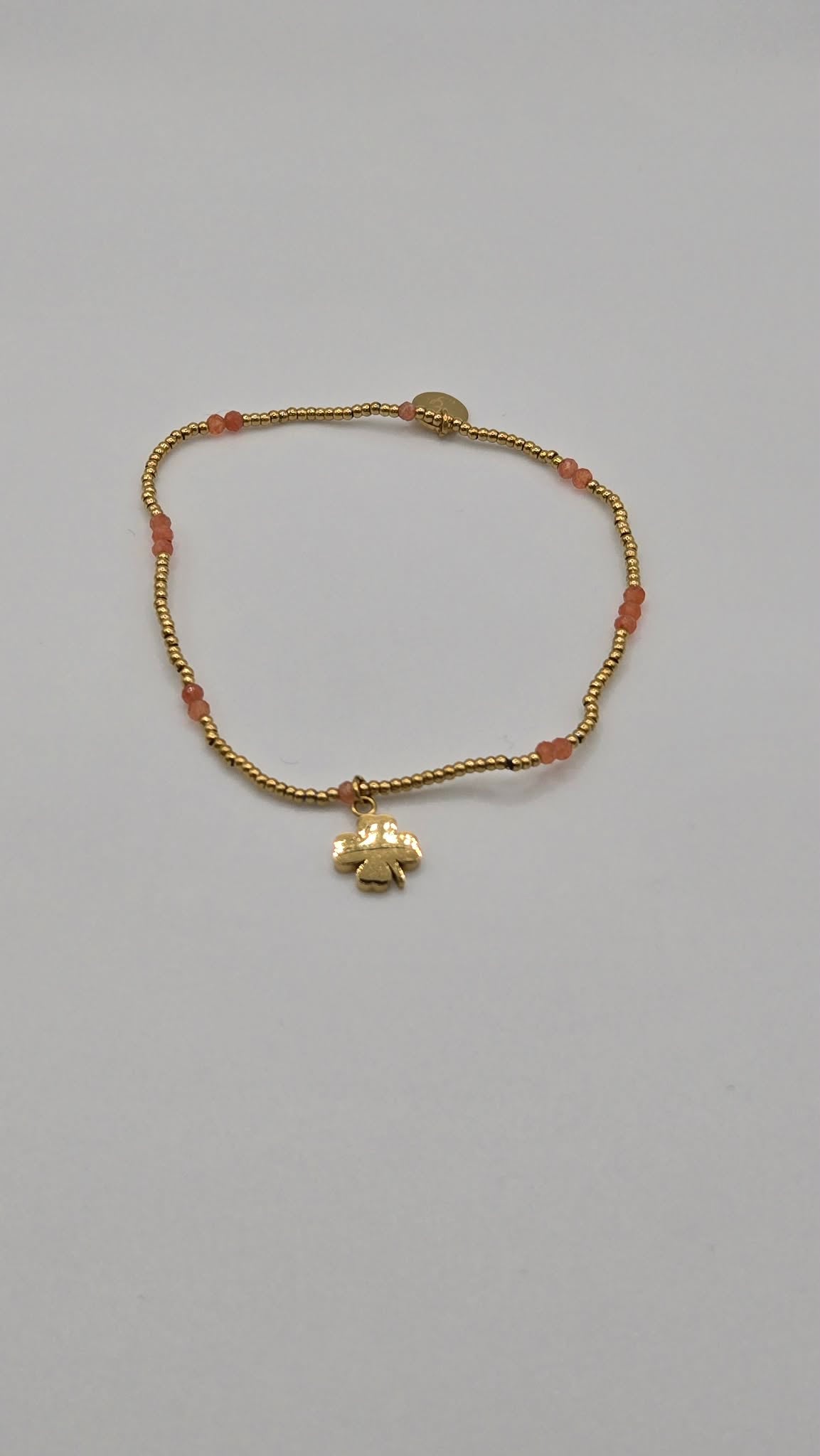Clover bracelet gilded and orange beads
